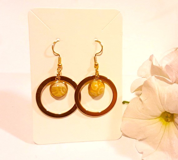 Indonesian coral gold tone large hoop earrings with 18k gold plated wires. Sublt patterning and cream beige gold colour gemstone.