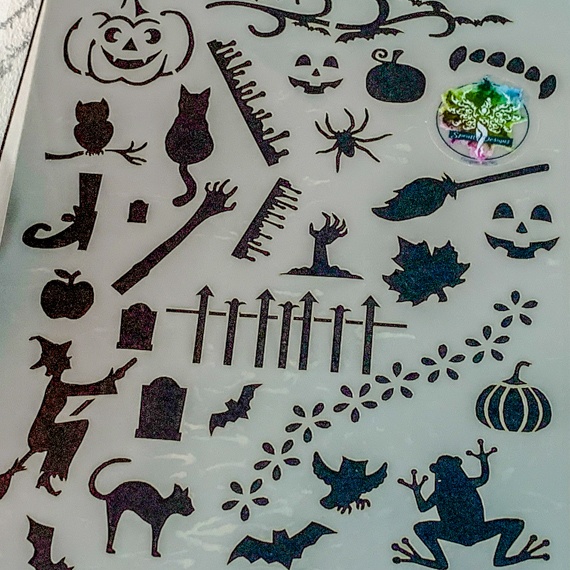 Magical Creatures Journal Stencil, Mythical wizardry Craft Stencil, Dragons, Fairies, witches, Pegasus, bats, cats, fairy, mermaids, showing smiling pumpkin, cat, perched owl, dripping blood, witches brrom, pumpkin, spider, leaf, zombie arm, haunted face, apple, flying witch, arched cat, tombstone, flying wol, bat, frog.