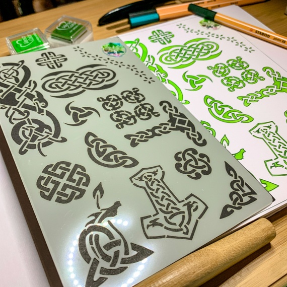 Celtic Journal Stencil Design 2 with a journal page off to right and pens laying on desk