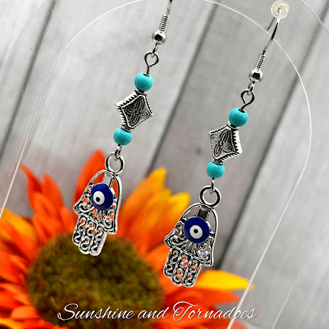 Handmade Drop Earrings with Silver Evil Eye Hamsa Charms and Turquoise Howlite Gemstone Beads. - Image 4
