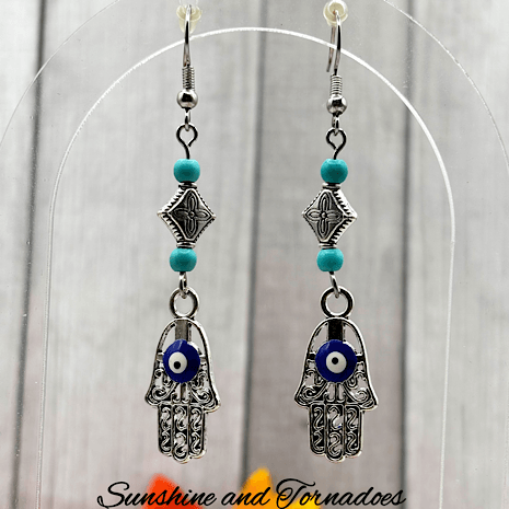 Handmade Drop Earrings with Silver Evil Eye Hamsa Charms and Turquoise Howlite Gemstone Beads. - Image 6