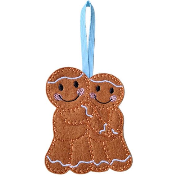 Handmade felt gingerbread sweethearts – couple in love, Mr & Mr version, with smiling embroidered faces, pink cheeks, and a light blue hanging ribbon