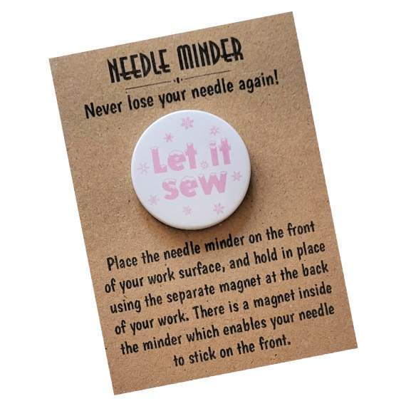 Let It Sew snowflake needle minder, pink lettering on white background, magnetic accessory for cross-stitch and embroidery