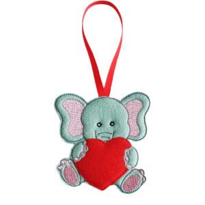 Little Elephant of Love Decoration – a handmade felt ornament featuring a cute grey elephant with pink ears holding a bright red heart, complete with a red ribbon loop for hanging. The heart can be personalised with a name, date, or short phrase.