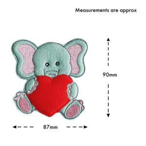 Little Elephant of Love Decoration shown with measurements – approximately 90mm tall and 87mm wide. The felt design features a cute grey elephant with pink ears holding a red heart.