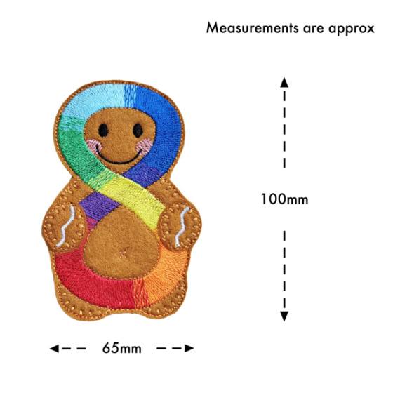 Handmade felt Neurodiversity Awareness Gingerbread Character with smiling face and colourful rainbow infinity symbol, displayed with approximate size 100mm tall and 65mm wide.