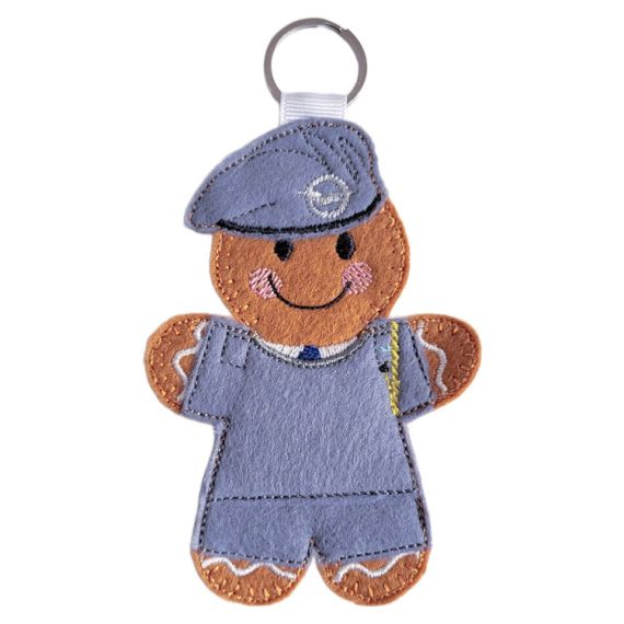 RAF Air Cadet Gingerbread Character keyring, handmade from soft felt, wearing RAF Cadet uniform and embroidered beret badge, attached to a white ribbon loop with metal keyring.