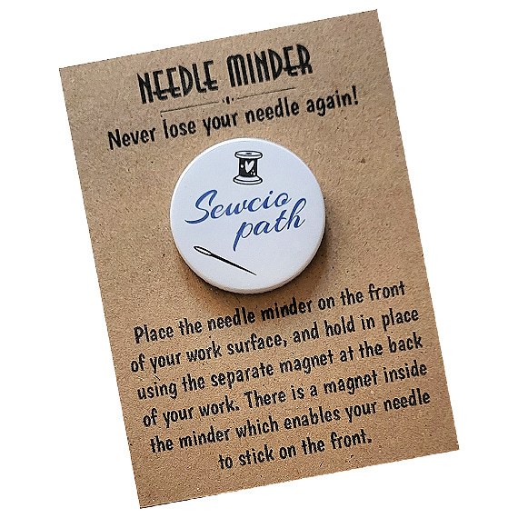 Funny sewing accessory, Sewciopath needle minder for cross stitch and embroidery, packaged on kraft presentation card with instructions.