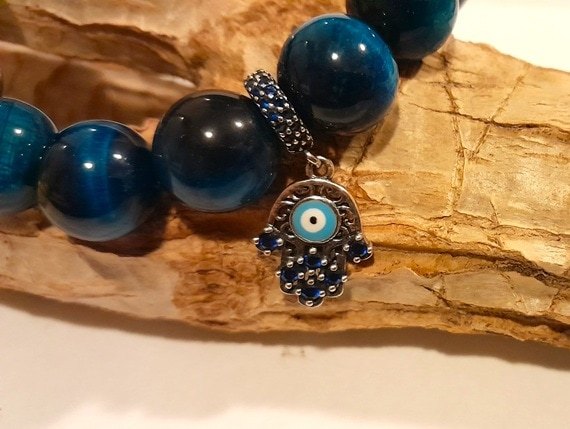 Blue tiger's eye 12mm bead stretch bracelet with cz hamsa hand