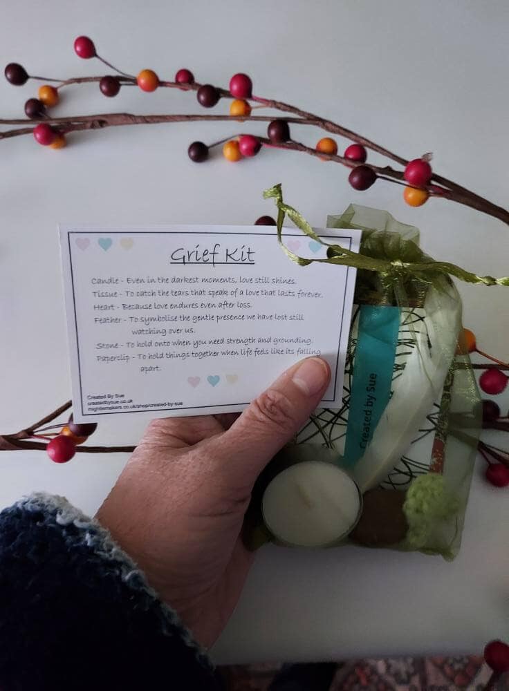 Picture shows green organza bag with contents for the Grief Kit