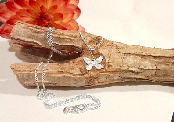 Sterling silver butterfly necklace with curb chain. Detail on wings and sturdy hanger bail