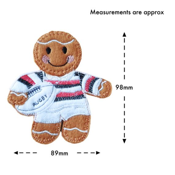 Felt gingerbread rugby player character wearing a white kit with red, black, and white hoops, holding a white rugby ball stitched with the word “Rugby.” Image includes approximate measurements: 98 mm tall and 89 mm wide.