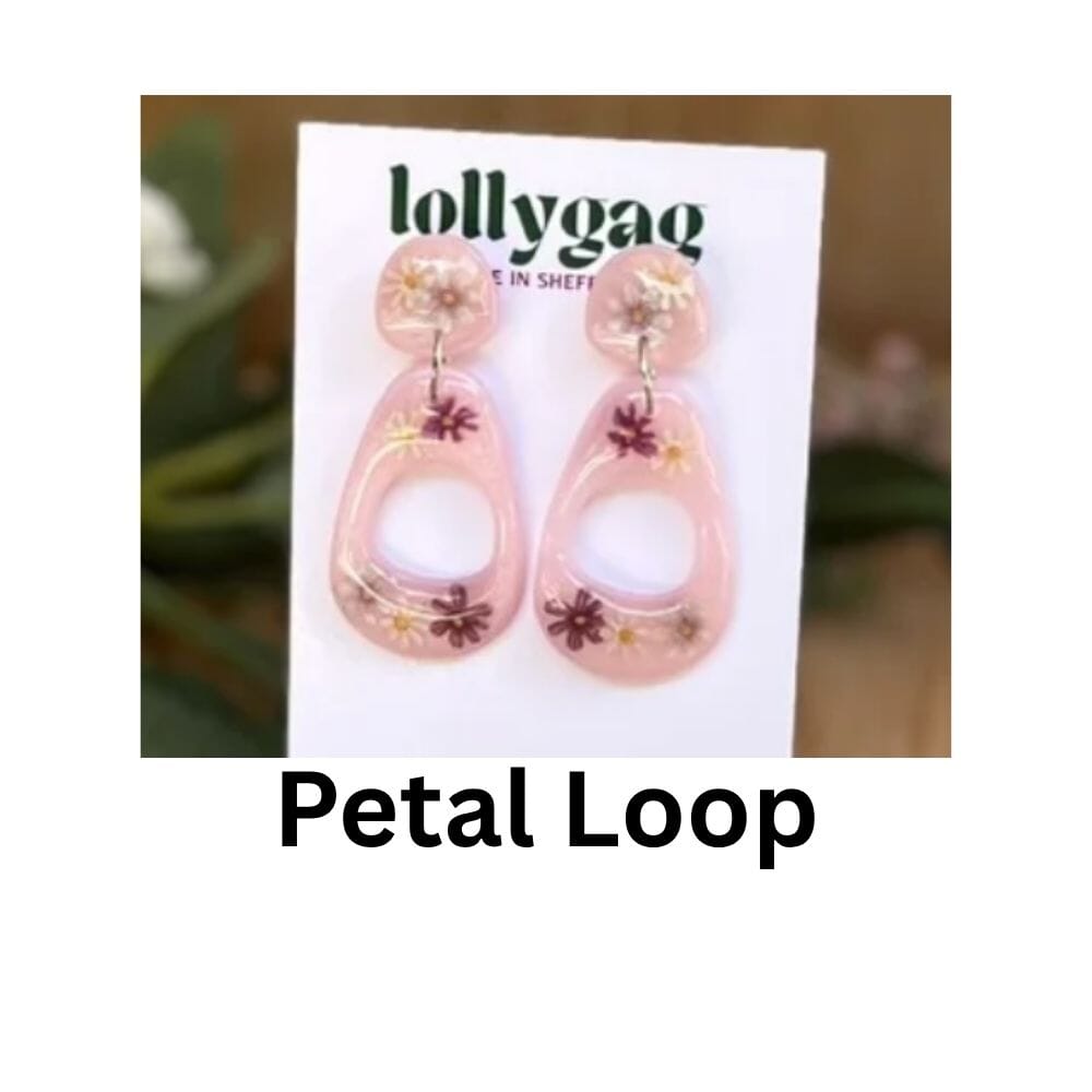 Petal Loop earrings by Lollygag Jewellery, featuring real pressed daisies and pink petals set into loop-shaped polymer clay earrings with a glossy resin finish, handmade in Sheffield.