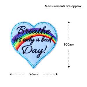 Embroidered felt heart decoration with a rainbow and the words “Breathe It’s Only a Bad Day”, shown with approximate measurements of 100mm high and 96mm wide.