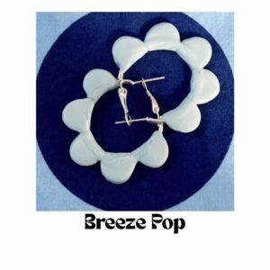 Breeze Pop hoop earrings by Lollygag featuring soft sky blue polymer clay petals arranged in a circular hoop, lightweight retro-inspired earrings handmade in Sheffield.