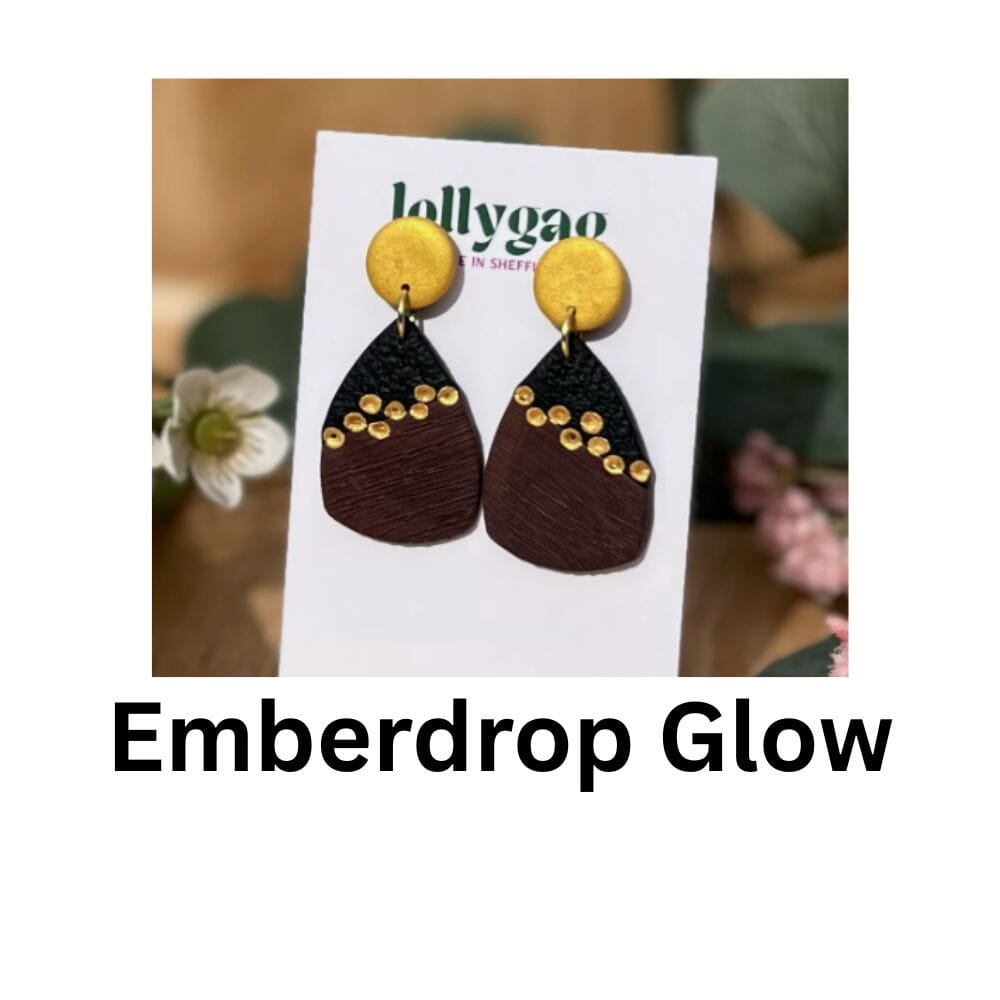 Emberdrop Glow teardrop polymer clay earrings with faux wood texture, gold stud tops and diagonal gold inlay detail, handmade in Sheffield by Lollygag Jewellery.