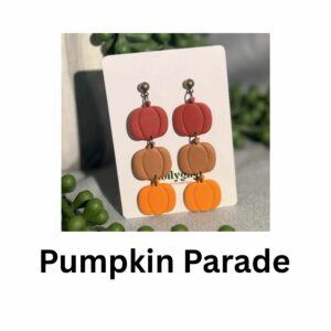 Pumpkin Parade earrings handmade from polymer clay featuring stacked pumpkin shapes in red, terracotta and orange tones, autumn jewellery by Lollygag Sheffield.