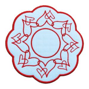 White scalloped decorative table mat with a red embroidered border and a circular wreath of hand-drawn style red hearts surrounding a plain centre, featuring a delicate stippled background texture.