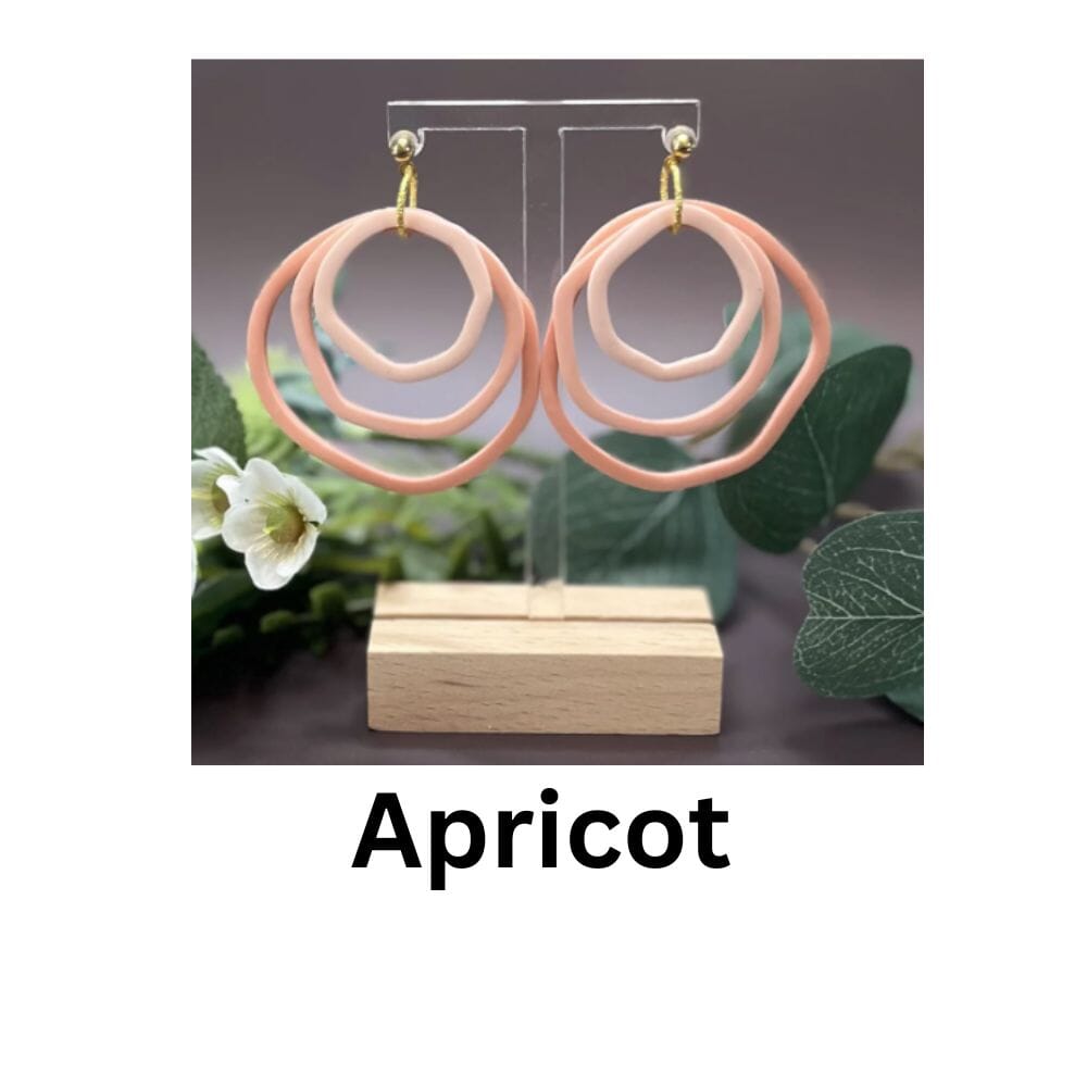 Shades Of Apricot gradient hoop earrings in warm apricot and pale orange tones, handmade polymer clay jewellery by Lollygag Sheffield.