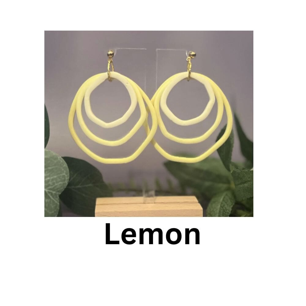 Shades Of Lemon gradient hoop earrings in soft yellow tones, handmade polymer clay dopamine dressing jewellery by Lollygag Sheffield.