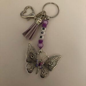 Butterfly Bag Charm/Keyring with Purple Beads and “MUM” personalisation. In Aid of Fibromyalgia Awareness.
