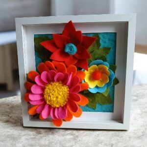 Three dimensional felt flower arrangement in a frame. All proceeds to The Stroke Association