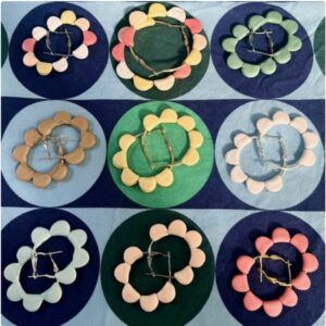 Petal Pop Collection handmade hoop earrings by Lollygag displayed as a group, featuring rounded polymer clay petal hoops in pastel, neutral and bright colours, dopamine dressing jewellery handmade in Sheffield.