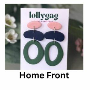 Home Front earrings by Lollygag with blush pink studs, navy bar connectors, and military green oval drops, handmade polymer clay earrings inspired by 1940s resilience.