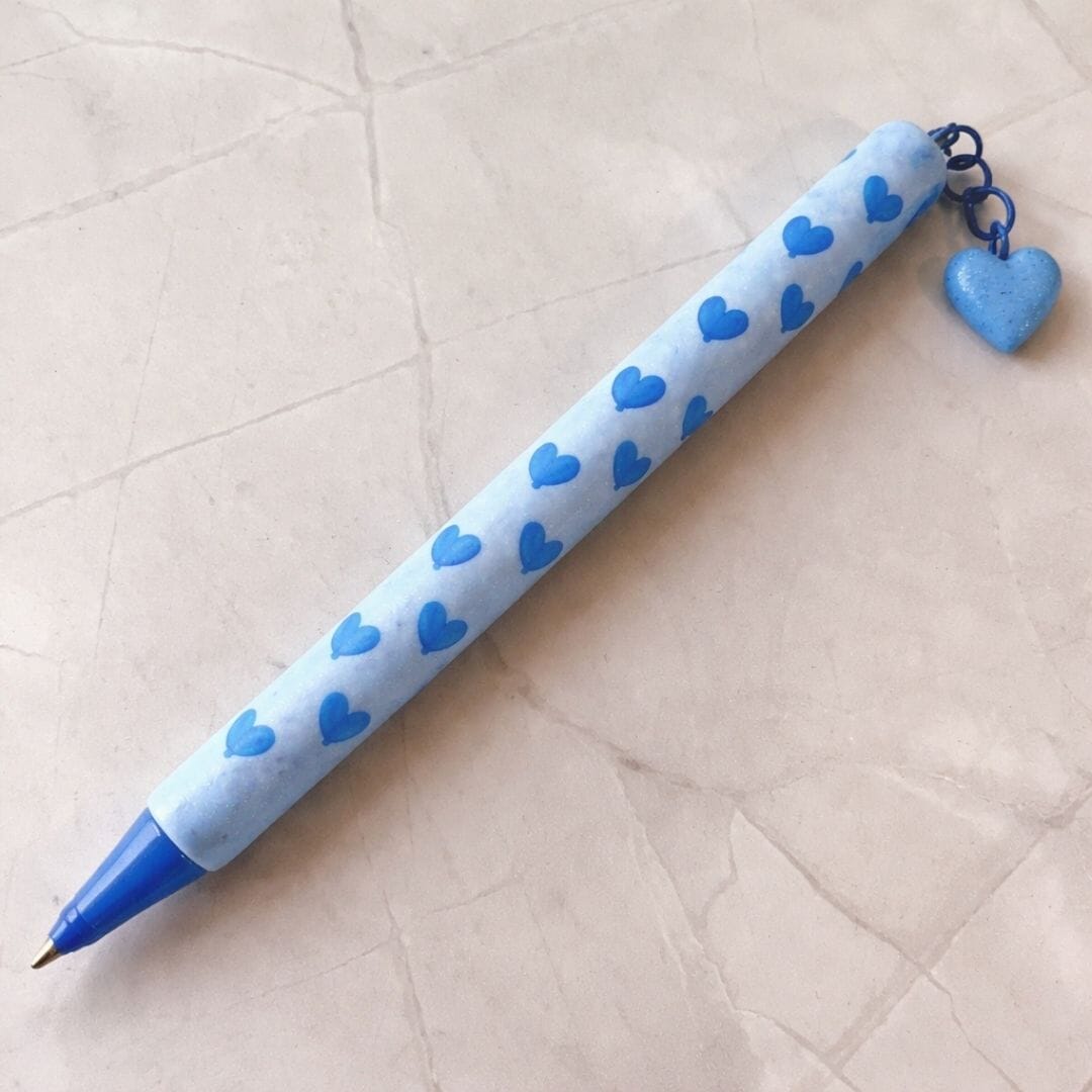 Handmade polymer clay handled pen with blue heart pattern and heart charm, Moments of Love limited edition Valentine’s Day gift by Lollygag Sheffield