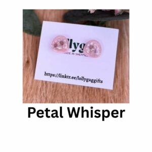 Petal Whisper earrings by Lollygag Jewellery, featuring small pressed flowers encased in blush pink polymer clay with a glossy resin finish, displayed as delicate stud earrings handmade in Sheffield.