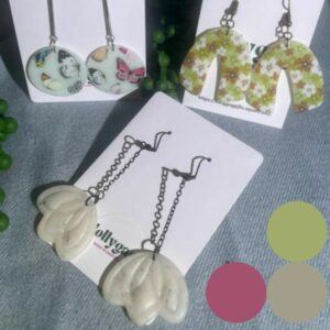 Group of Ethereal Collection polymer clay earrings by Lollygag Jewellery, featuring translucent designs with butterflies, sculpted white blooms, and daisy meadow prints, handmade in Sheffield.