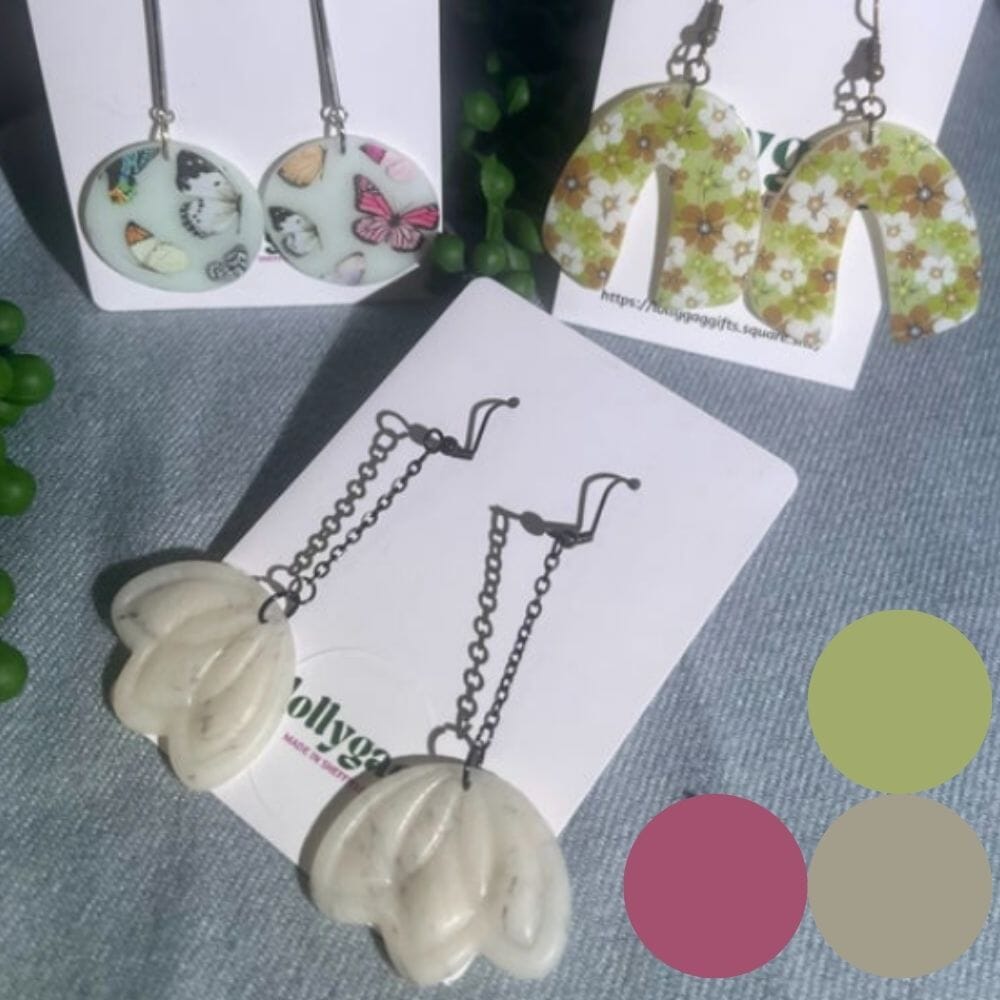 Group of Ethereal Collection polymer clay earrings by Lollygag Jewellery, featuring translucent designs with butterflies, sculpted white blooms, and daisy meadow prints, handmade in Sheffield.