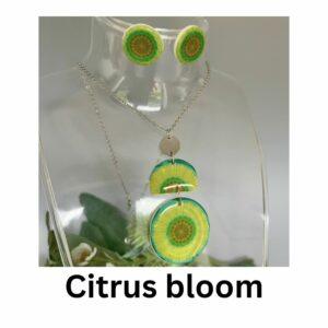 Citrus Bloom vintage wallpaper necklace and stud earring set with green and yellow circular floral pattern, handmade polymer clay jewellery by Lollygag Sheffield.