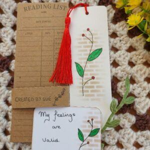 hand drawn botanical bookmark with red tassel, matching affirmation card, reading list bookish gift.