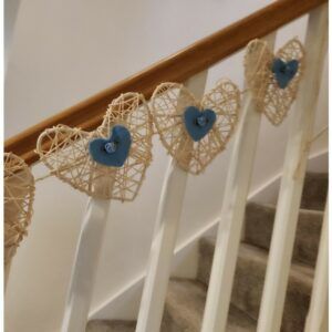 Off White Rattan Hearts Bunting, with blue felt hearts and blue satin roses