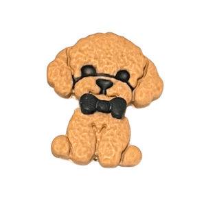 Handmade polymer clay cavapoo dog charm in warm tan with black bow tie, textured curly fur and cute cartoon style design.