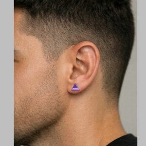 Gender neutral purple triangle stud earrings worn by a man, small geometric polymer clay earrings inspired by dopamine dressing jewellery trend