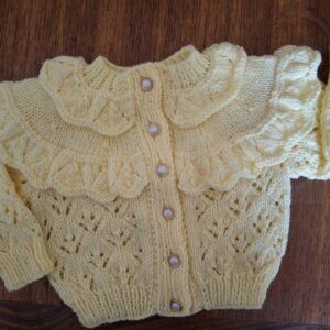 Hand Knitted Lace-Trimmed Cardigan: Adorable Fashion for Little Girls