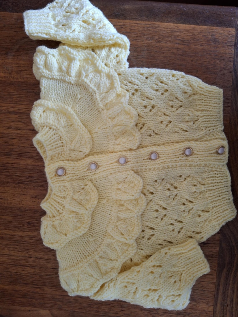 Hand Knitted Lace-Trimmed Cardigan: Adorable Fashion for Little Girls