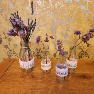 Set of 4 mini bottle vases, with embroidered band detailing
