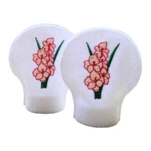 Set of two white felt tealight covers embroidered with pink gladiolus flowers and green leaves, designed to fit over standard LED tealights.