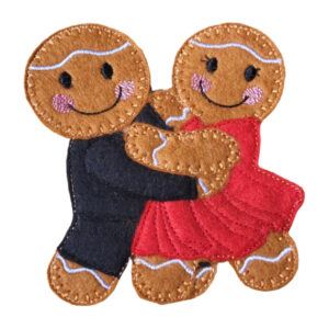 Felt gingerbread couple dancing together, with one character wearing a black outfit and the other in a red dress, shown mid-twirl with smiling faces and stitched details.