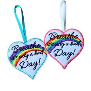 A small heart with a gentle reminder to pause and breathe. This hanging decoration shares the message ‘Breathe It’s Only a Bad Day’, offering comfort, reassurance, and a little light when it is needed most. A thoughtful keepsake to be treasured long after it is given.