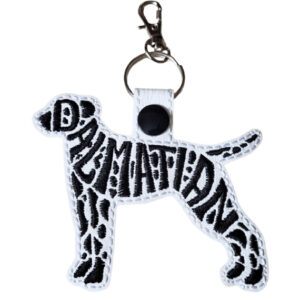 Dalmatian word art keyring in a standing dog silhouette, embroidered in black thread on white faux leather with the word “Dalmatian” forming the body and spot pattern. The keyring is attached to a metal split ring with a lobster clasp.