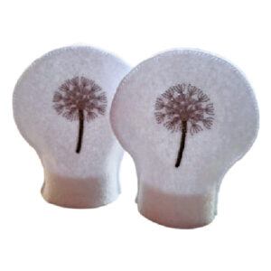 Set of two white felt tealight covers, each embroidered with a delicate dandelion clock design, symbolising hope, wishes, and new beginnings.