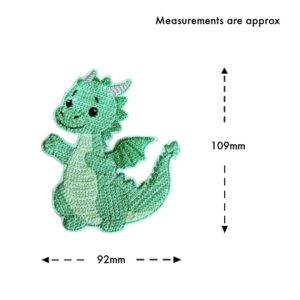 Knit stitch dragon hanging decoration shown with approximate measurements of 109mm height and 92mm width