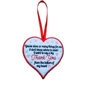 Heart-shaped felt hanging decoration with a ribbon loop. The heart features an embroidered thank you message reading, “You’ve done so many things for me I don’t know where to start! I want to say a big Thank You from the bottom of my heart,” surrounded by small decorative hearts and stars.