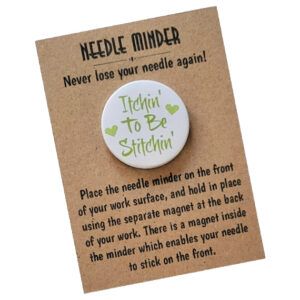 Round magnetic needle minder with lime green text that reads ‘Itchin’ To Be Stitchin’’ and two small green hearts, on a white background. Displayed on kraft card with instructions.