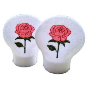 Set of two white felt tealight covers embroidered with pink roses and green leaves, designed to slip over standard LED tealights.