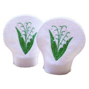 Set of two white felt tealight covers embroidered with Lily of the Valley flowers in green and white, designed to slip over LED tealights.